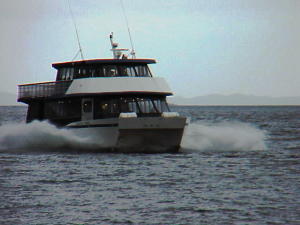 A catamaran brings tourists to Rudyerd Bay each day in summer.
